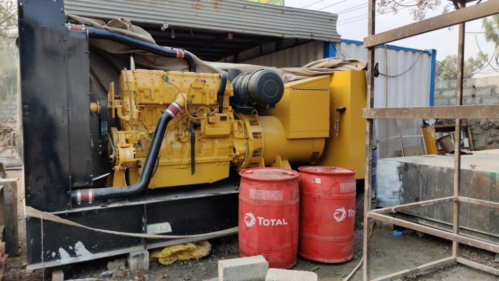 Generator in daylight with some gas cans in front of it
